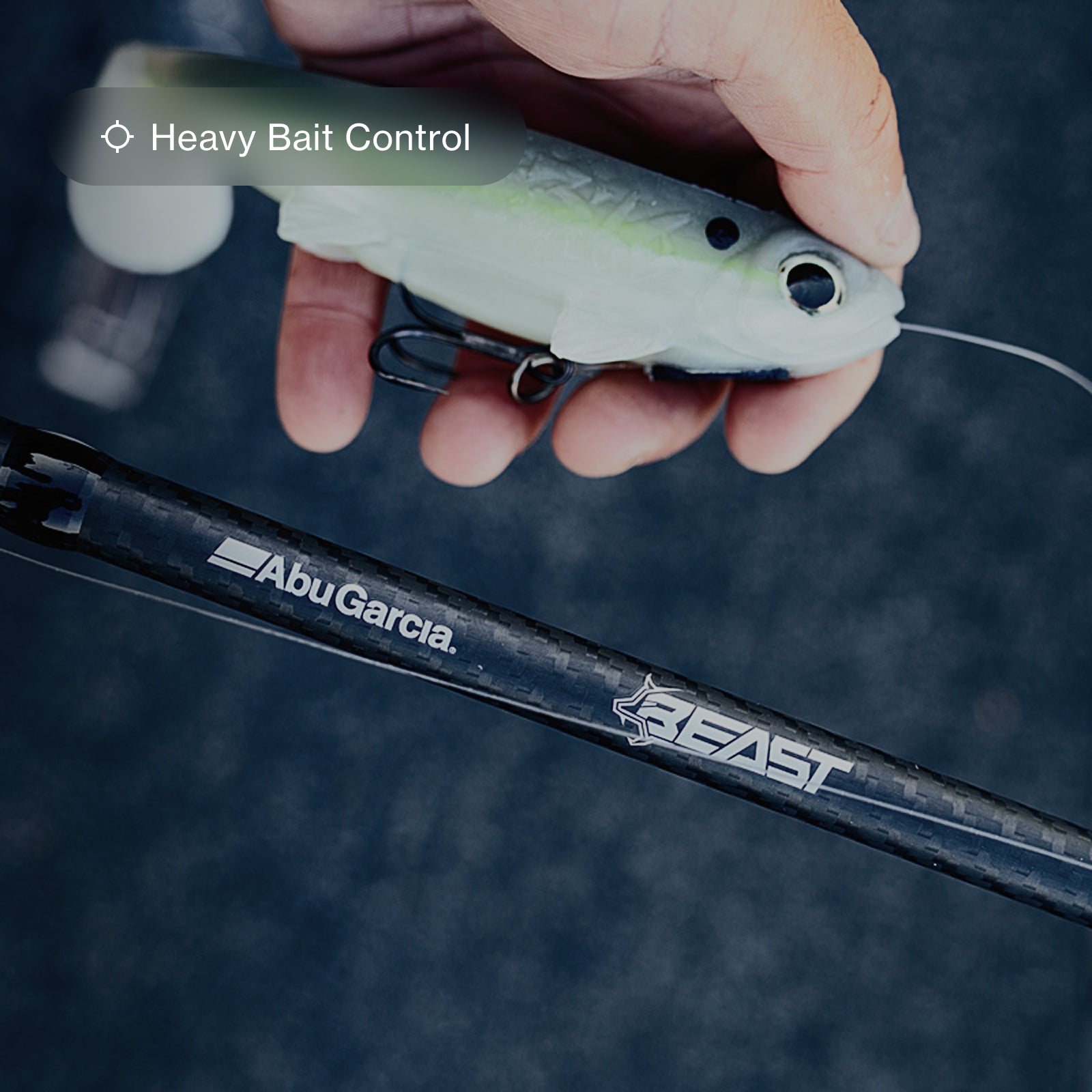 Man holding large bait next to Beast fishing rod